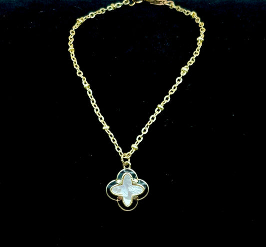 #148 Gold-Filled Clover Leaf Charm of Mother of Pearl Outlined in Black Lacquer on 7" Gold-Filled Chain Bracelet