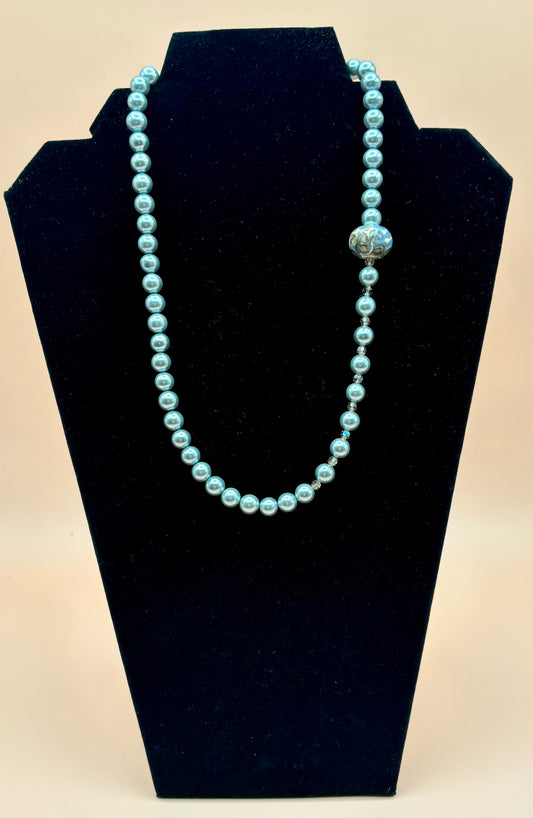 #145 Blue Gray Dyed Pearls enhance by Golden Shadow Swarovski Crystals and a Hand Painted Porcelain Bead with Sterling Silver Lobster Clasp 20"