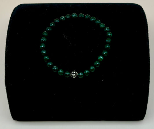 #173 Dark Green Jasper 7" Stretch Bracelet spaced with a Silver Bali Beads.